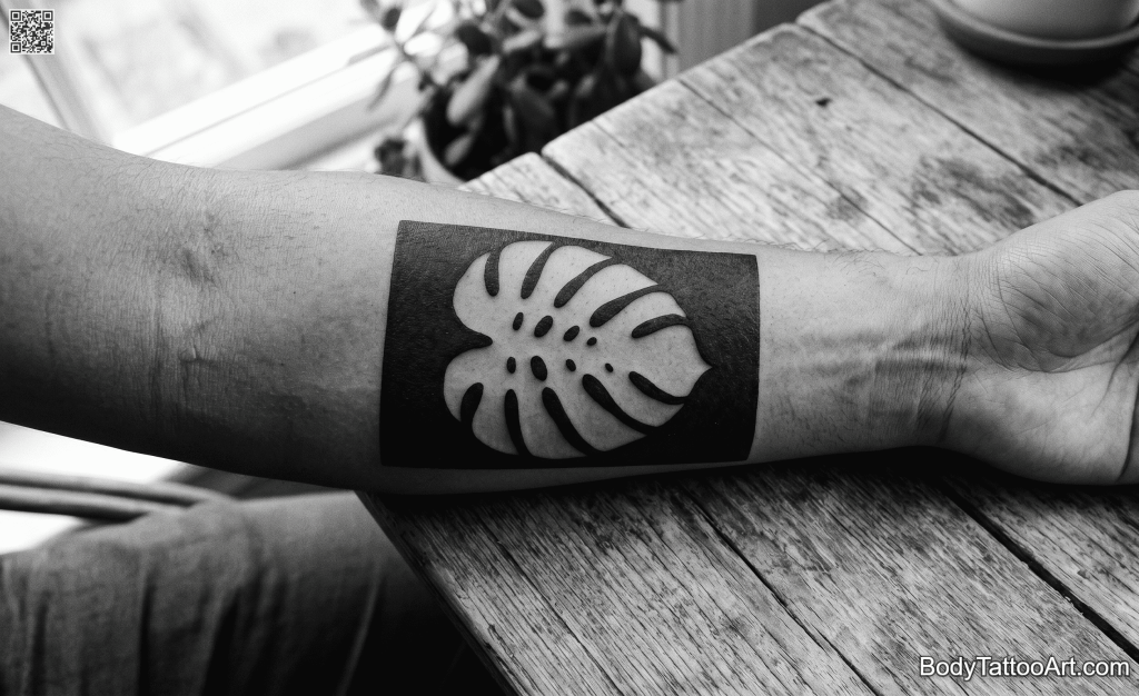  Negative space blackwork Monstera Leaf Tattoo